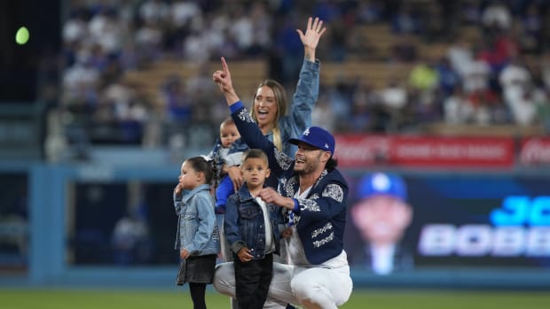 Sep 22, 2023; Los Angeles, California, USA; Los Angeles Dodgers relief pitcher Joe Kelly (17) poses with wife Ashley Kelly (Ashley Parks) and children, sons Knox Kelly and Kai Kelly and twins Crue Kelly and Blake Kelly, at Dodger Stadium. Mandatory Credit: Kirby Lee-USA TODAY Sports  